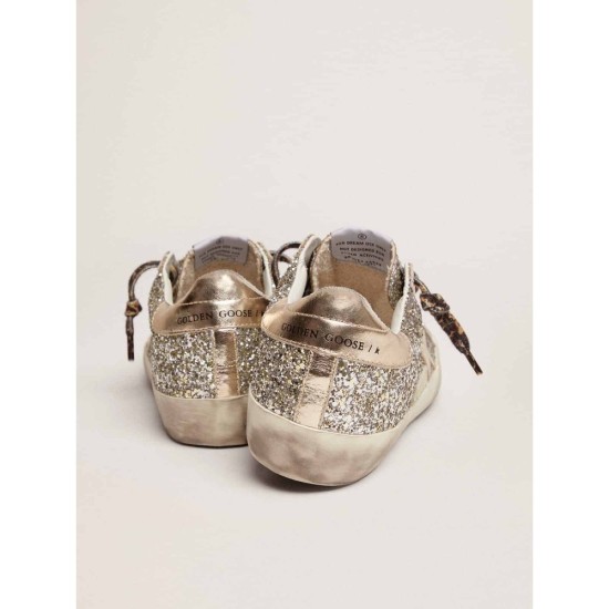 Super-Star sneakers in platinum-colored glitter with star and heel tab in tone-on-tone laminated leather Super-Star sneakers in platinum-colored glitter with star and heel tab in tone-on-tone laminated leather