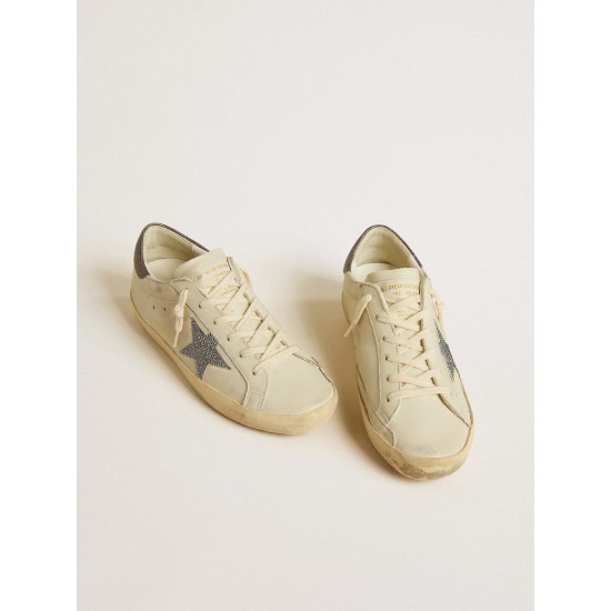 Super-Star LTD with cream-colored leather star with Swarovski crystals and blue leather heel tab with lizard print Super-Star LTD with cream-colored leather star with Swarovski crystals and blue leather heel tab with lizard print