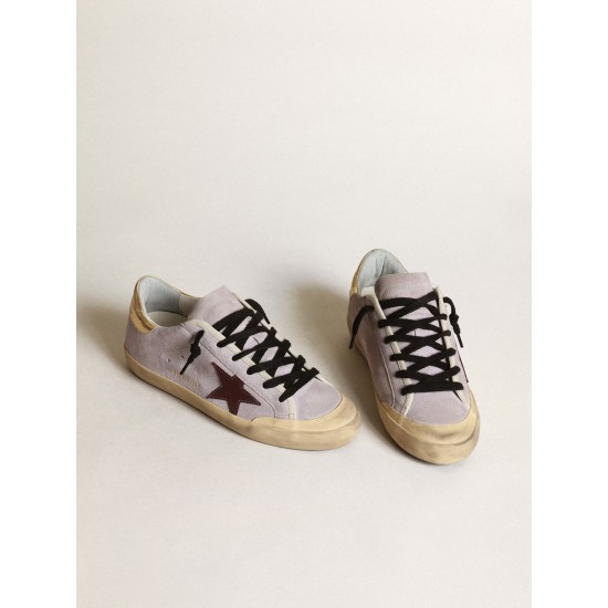 Super-Star in lilac suede with a brown star and gold heel tab Super-Star in lilac suede with a brown star and gold heel tab